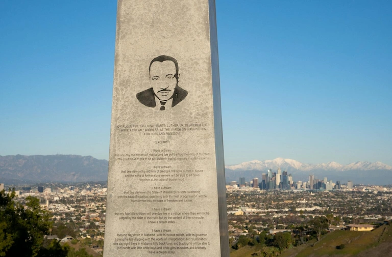 Does CookOut Close on Martin Luther King Day? 3 Martin Luther King Jr. monument overlooking Los Angeles skyline with mountain backdrop.