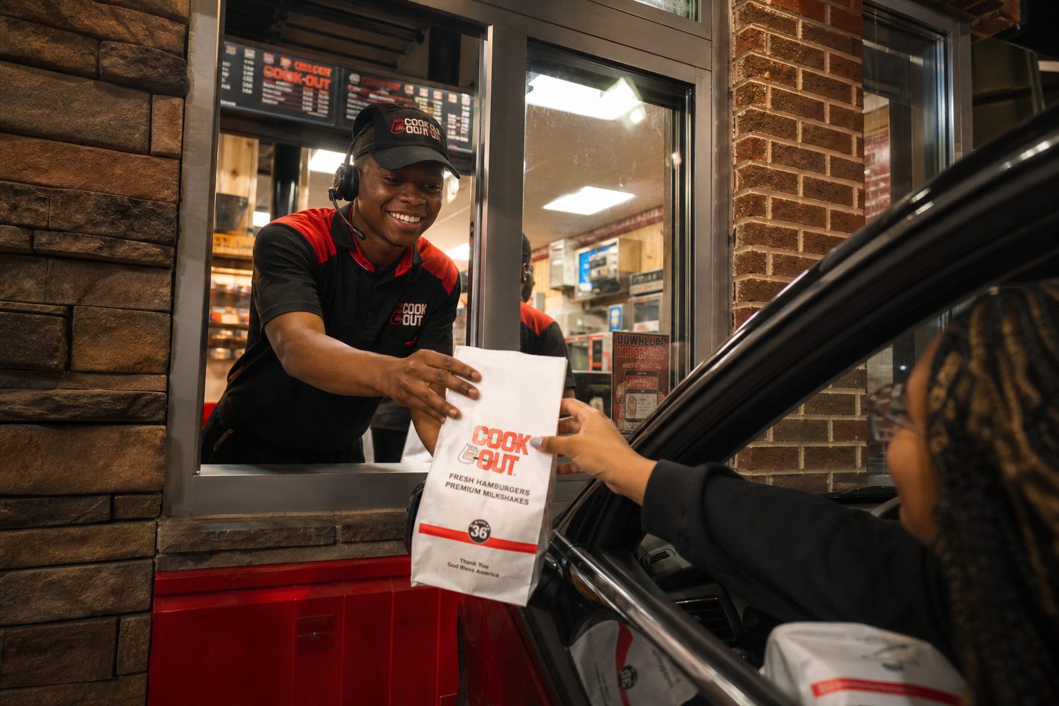Does Cookout Deliver? Enjoy Your Favorite Meals at Home 3 Does Cookout deliver — Cook Out employee handing food bag to customer at drive-thru pickup window